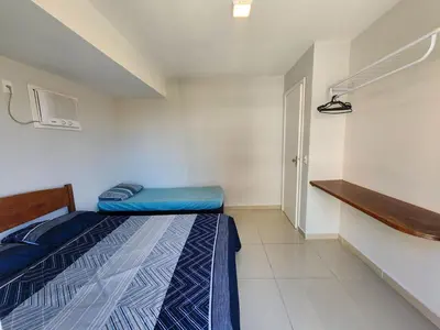 Uma cama ou camas num quarto em Apto El Shadday 301 cento e cinquenta metros do mar