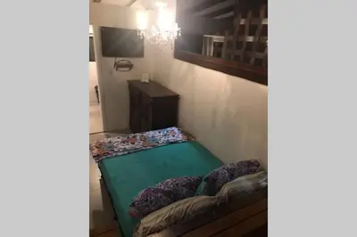Uma cama ou camas num quarto em 7. Apartamento com Banheira Vista Mar Bombinhas