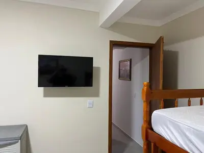Uma cama ou camas num quarto em Apartamento Só Alegria