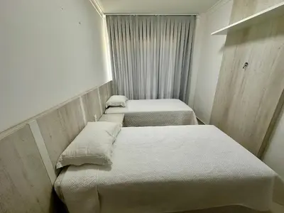 Uma cama ou camas num quarto em Residencial CasapraiadaLagoinha