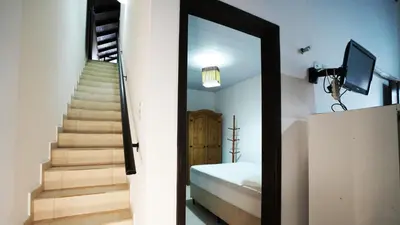 Uma televisão e/ou sistema de entretenimento em Residencial Beija Flor Apartamento 23