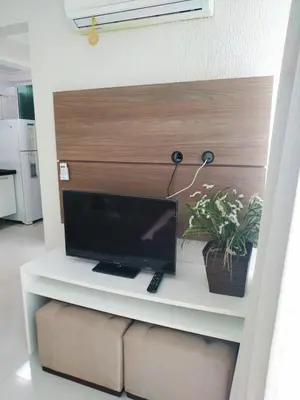 Uma televisão e/ou sistema de entretenimento em Vivendas Summer Beach Apto Particular