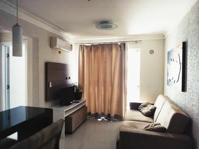 Uma televisão e/ou sistema de entretenimento em Vivendas Summer Beach Apto Particular