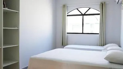 Uma cama ou camas num quarto em Residencial Dona Dina - Mestre Naro