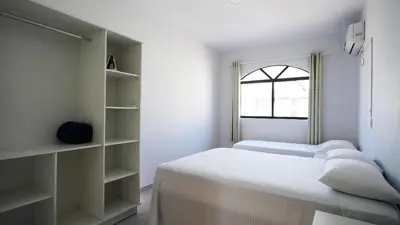 Uma cama ou camas num quarto em Residencial Dona Dina - Mestre Naro