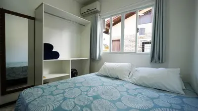 Uma cama ou camas num quarto em Residencial Adolfo - Mestre Naro