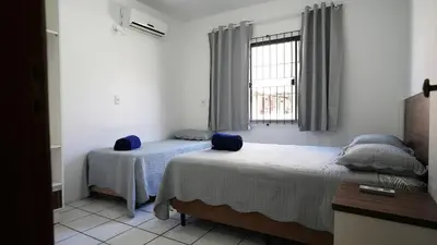 Uma cama ou camas num quarto em Casa Grande - Mestre Naro