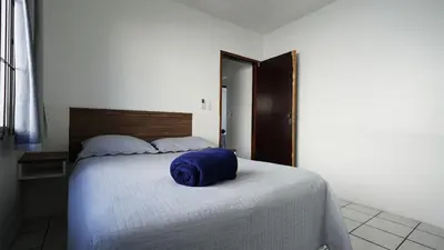Uma cama ou camas num quarto em Casa Grande - Mestre Naro