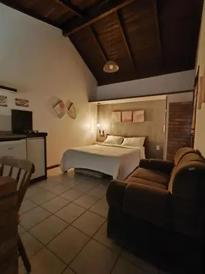 Uma cama ou camas num quarto em Pousadinha e Residencial Sto António - Praia de Bombas/Bombinhas-SC