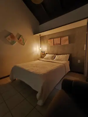 Uma cama ou camas num quarto em Pousadinha e Residencial Sto António - Praia de Bombas/Bombinhas-SC