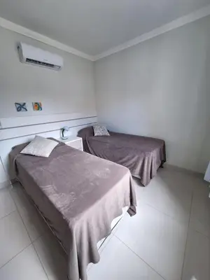 Uma cama ou camas num quarto em Apartamentos Vida Mansa