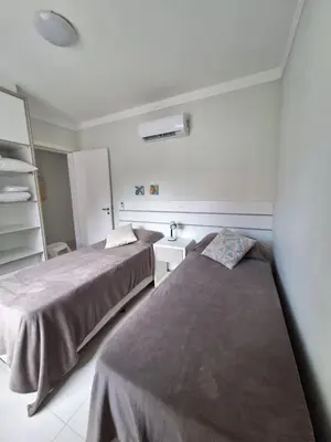 Uma cama ou camas num quarto em Apartamentos Vida Mansa