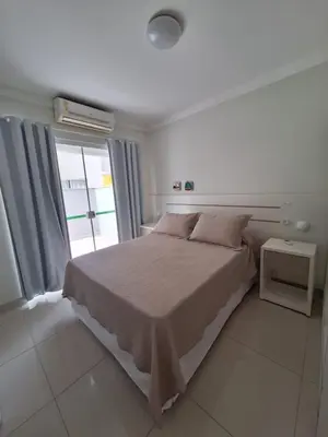 Uma cama ou camas num quarto em Apartamentos Vida Mansa