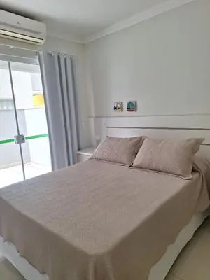 Uma cama ou camas num quarto em Apartamentos Vida Mansa