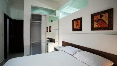 Uma cama ou camas num quarto em Residencial Beija Flor Loft 11