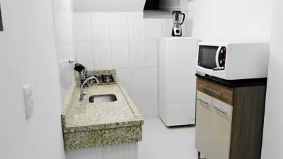 A cozinha ou kitchenette de Residencial Beija Flor Loft 11