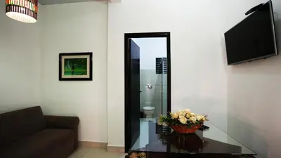 Uma televisão e/ou sistema de entretenimento em Residencial Beija Flor Loft 11