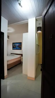Uma cama ou camas num quarto em Loft 12 residencial beija flor