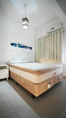 Uma cama ou camas num quarto em Residencial Beija Flor Apartamento 13