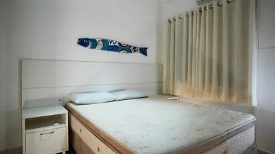Uma cama ou camas num quarto em Residencial Beija Flor Apartamento 13