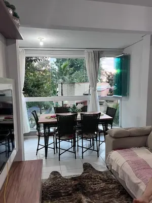 Uma área de estar em RESIDENCIAL BORBOLETAS DO MAR