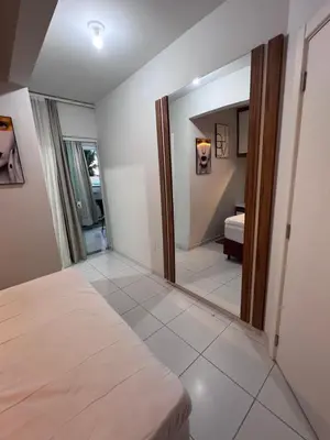 Uma cama ou camas num quarto em RESIDENCIAL BORBOLETAS DO MAR
