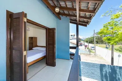 Uma cama ou camas num quarto em Casa Patta - 05 dormitórios, com piscina.