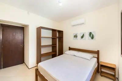 Uma cama ou camas num quarto em Casa Patta - 05 dormitórios, com piscina.