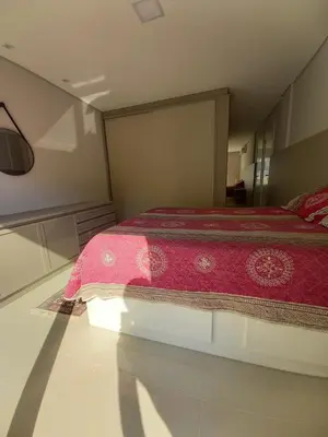 Uma cama ou camas num quarto em Cobertura Bombinhas