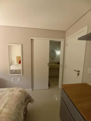 Uma cama ou camas num quarto em Cobertura Bombinhas