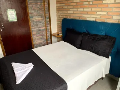 Uma cama ou camas num quarto em Hostel Vento Leste