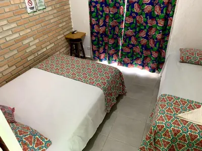 Uma cama ou camas num quarto em Hostel Vento Leste