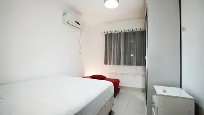 Uma cama ou camas num quarto em Apartamento 21 Residencial Beija Flor