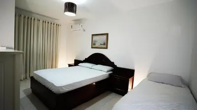 Uma cama ou camas num quarto em Apartamento 21 Residencial Beija Flor