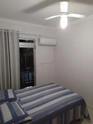 Uma cama ou camas num quarto em AP Itapema