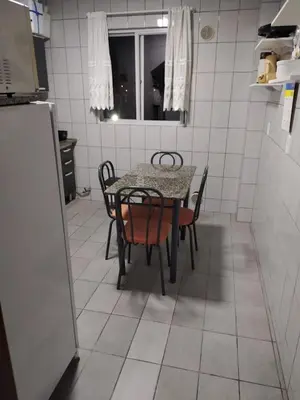 A cozinha ou kitchenette de Apartamento Itapema 80 metros do mar!