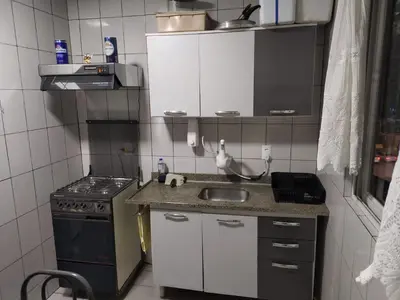 A cozinha ou kitchenette de Apartamento Itapema 80 metros do mar!
