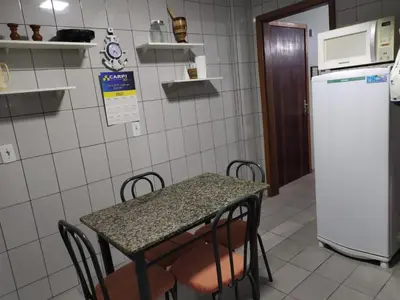 A cozinha ou kitchenette de Apartamento Itapema 80 metros do mar!