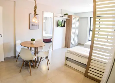 Uma cama ou camas num quarto em RESIDENCIAL MAR BLUE