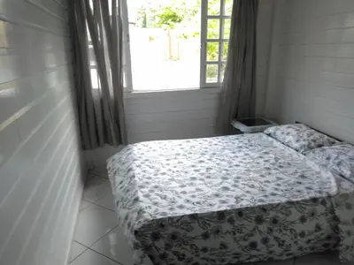Uma cama ou camas num quarto em Casa familiar na Praia de Morrinhos