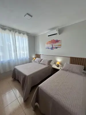 Uma cama ou camas num quarto em Praia De Palmas, apartamento 2 quartos, completo próximo a praia e todo comercio