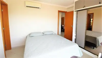 Uma cama ou camas num quarto em 1024 - Apartamento em Bombinhas para locação de temporada - Praia de Bombas