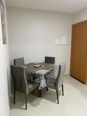 Uma área de estar em Residencial Helena Perequê Porto Belo SC
