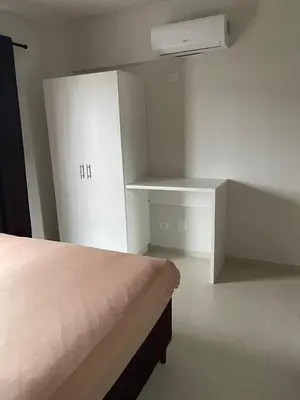 Uma cama ou camas num quarto em Residencial Helena Perequê Porto Belo SC