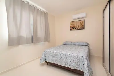 Uma cama ou camas num quarto em Aluguel Apartamento 2 quartos s 1 suíte Bombas SC