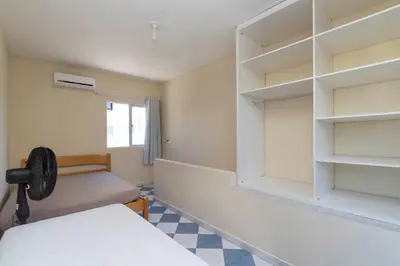 Uma cama ou camas num quarto em Residencial Melfi 2