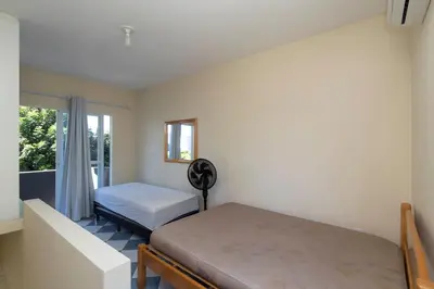 Uma cama ou camas num quarto em Residencial Melfi 2