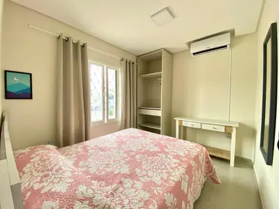 Uma cama ou camas num quarto em Ondas do Mar Residencial