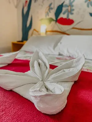 Uma cama ou camas num quarto em Pousada Praia de Bombinhas