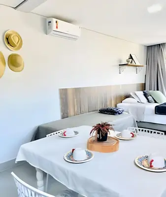 Uma cama ou camas num quarto em Studio novo 200m da praia de Bombinhas
